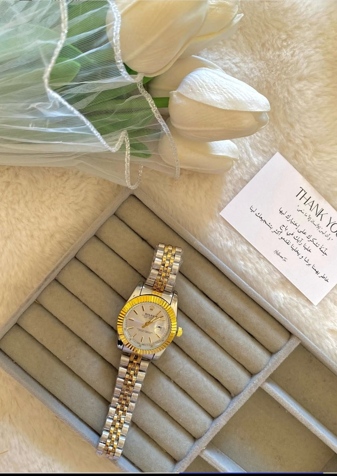 Montre dorée et argent 