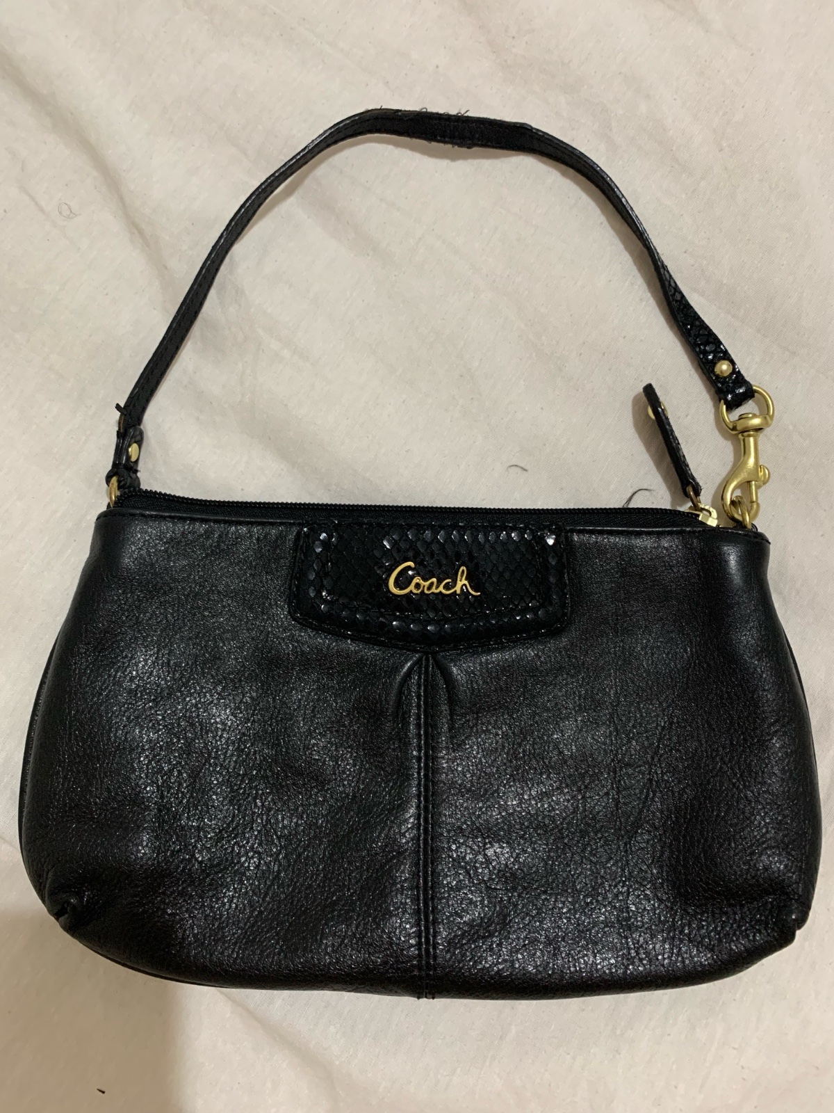 Pochette Coach authantique noir en cuir