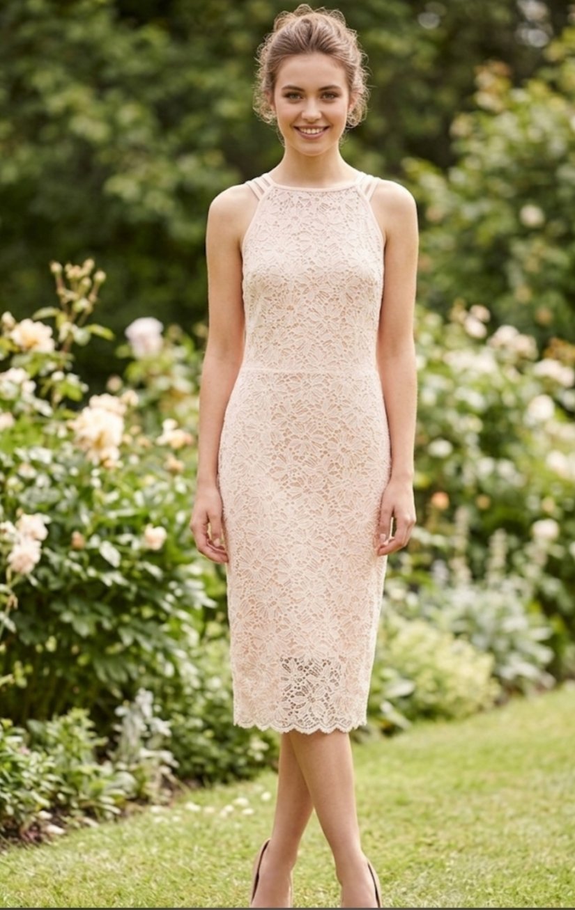 Une très belle robe en saumon clair taille 38 comme neuve importation 