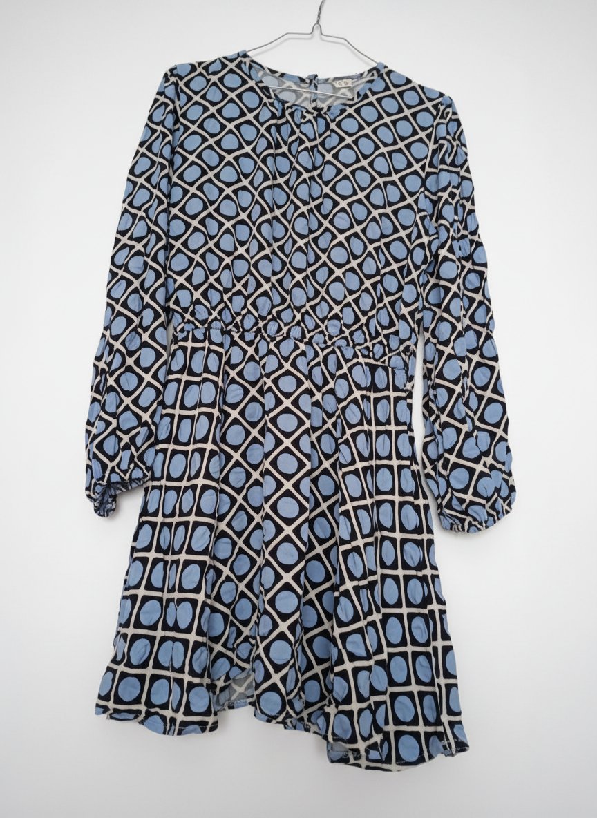 Une très belle robe tissu bered comme neuve 