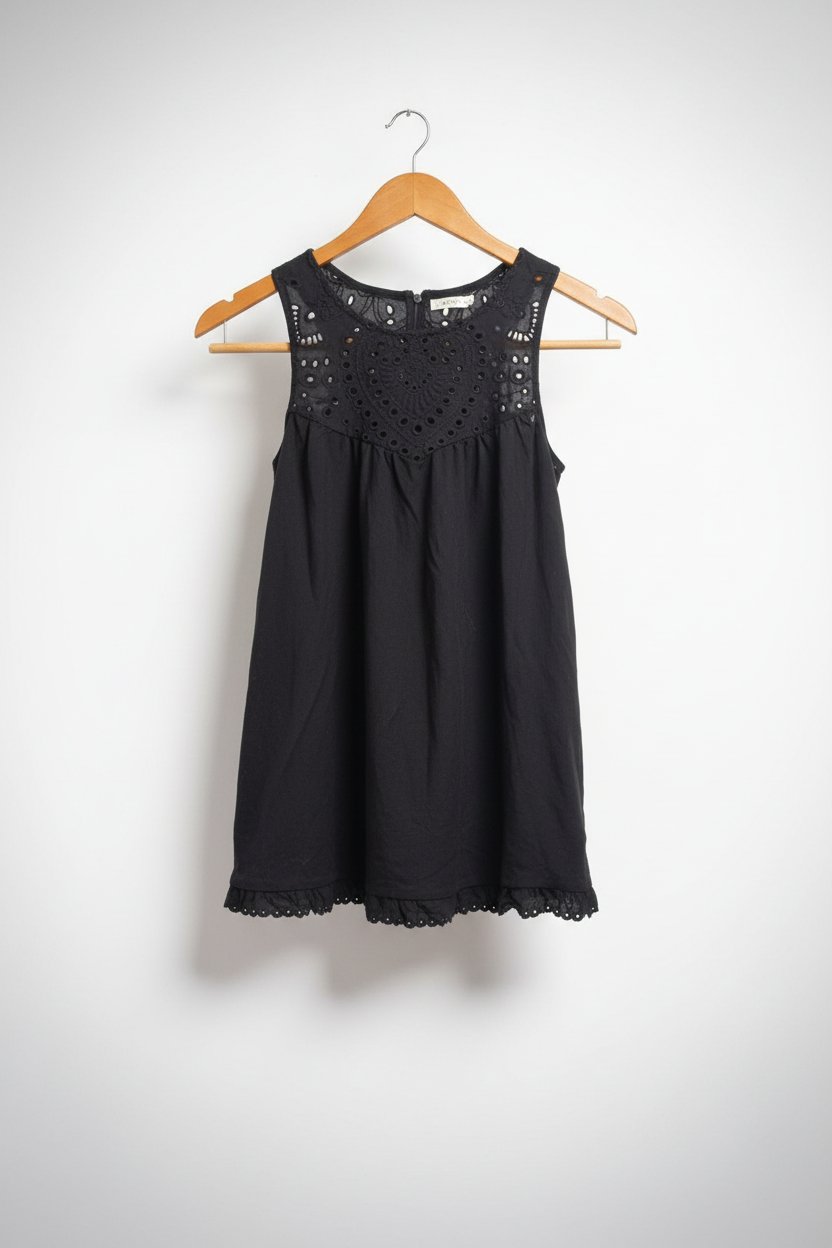 Trés jolie blouse sans manches signature neuf
