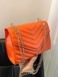Sac à chevron orange fluo matelassé à rabat. 