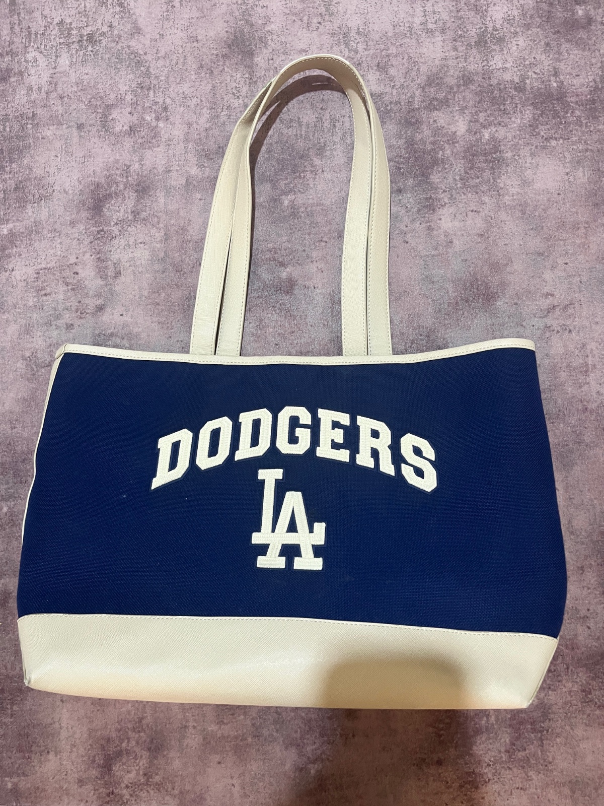 A navy blue MLB Los Angeles Dodgers varsity canvas tote bag