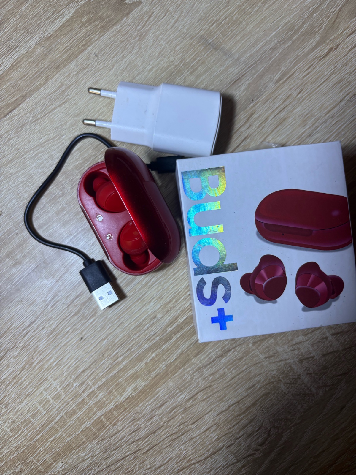 Red earbuds with USB and charger head 