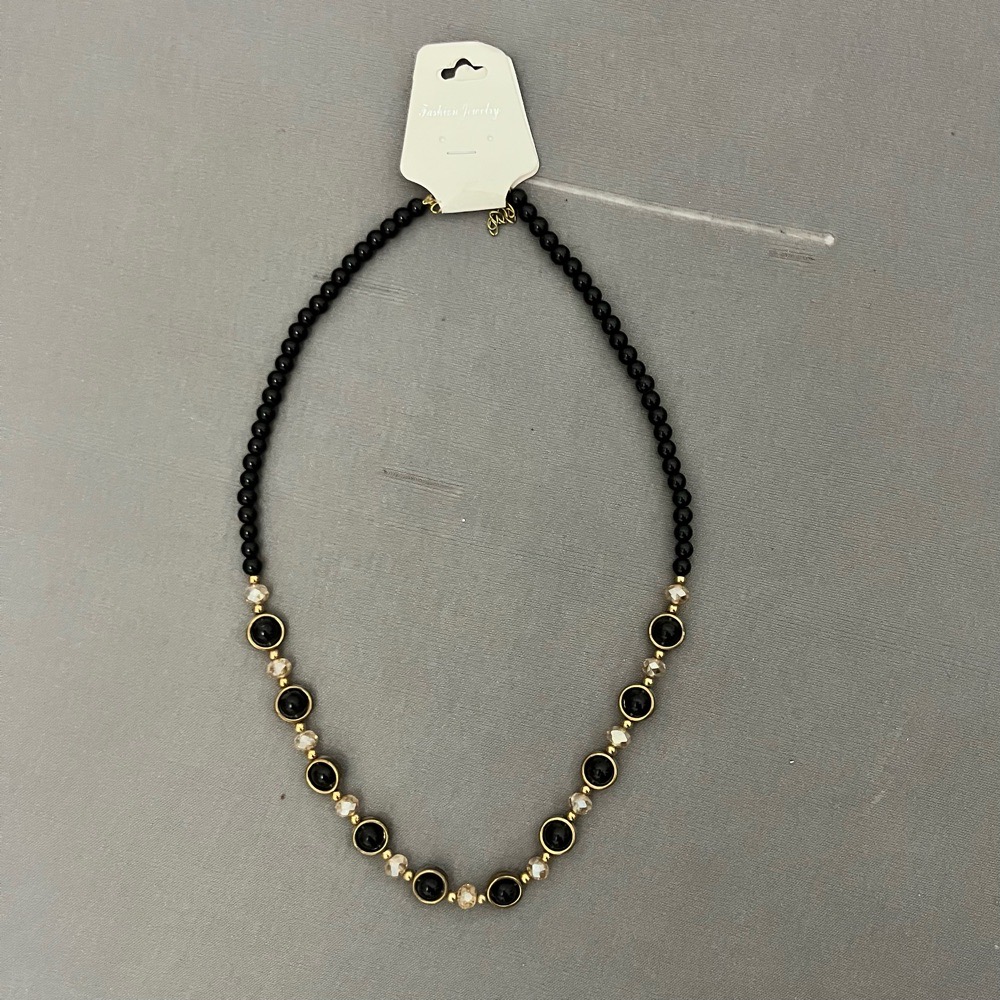 Collier noir doré