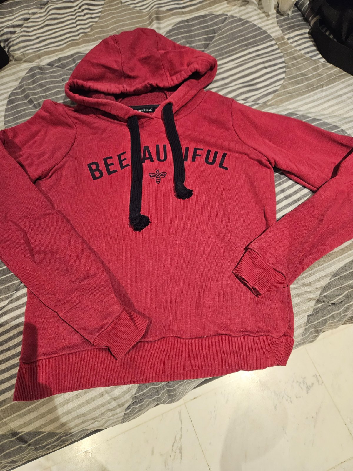 Capuche en très bon état 