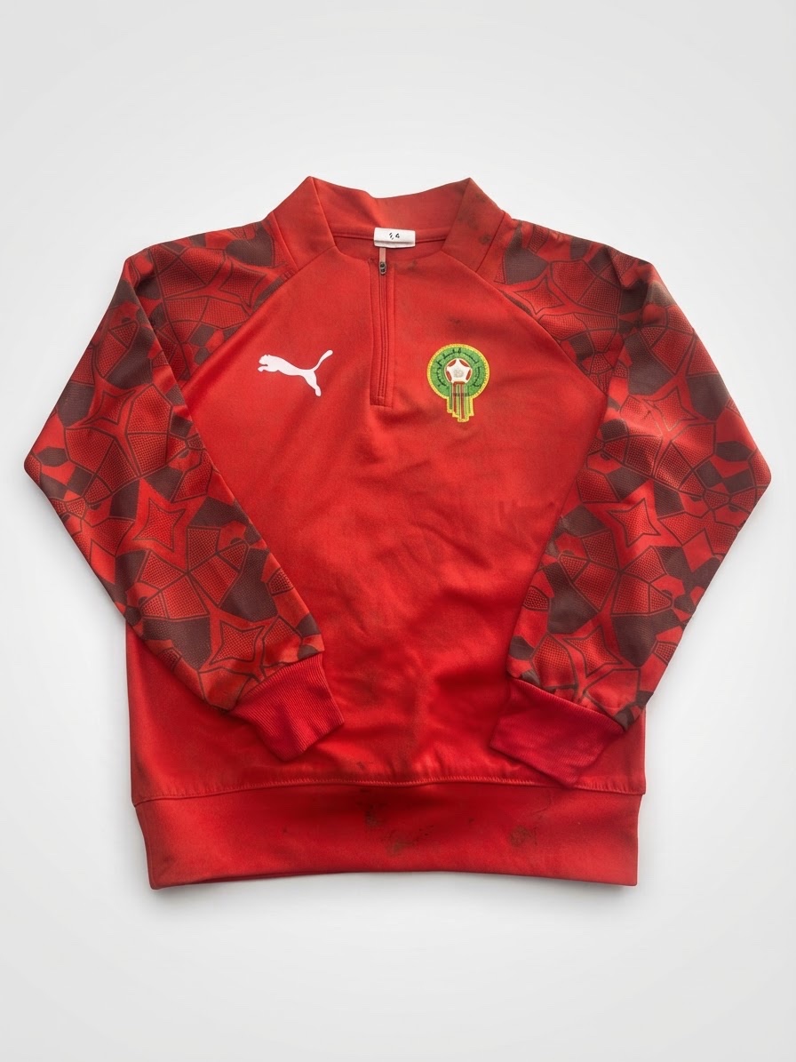 Sweat-shirt ou un quart de zip (quarter-zip) Puma de la collection FtblCulture de l'équipe nationale du Maroc (FRMF).