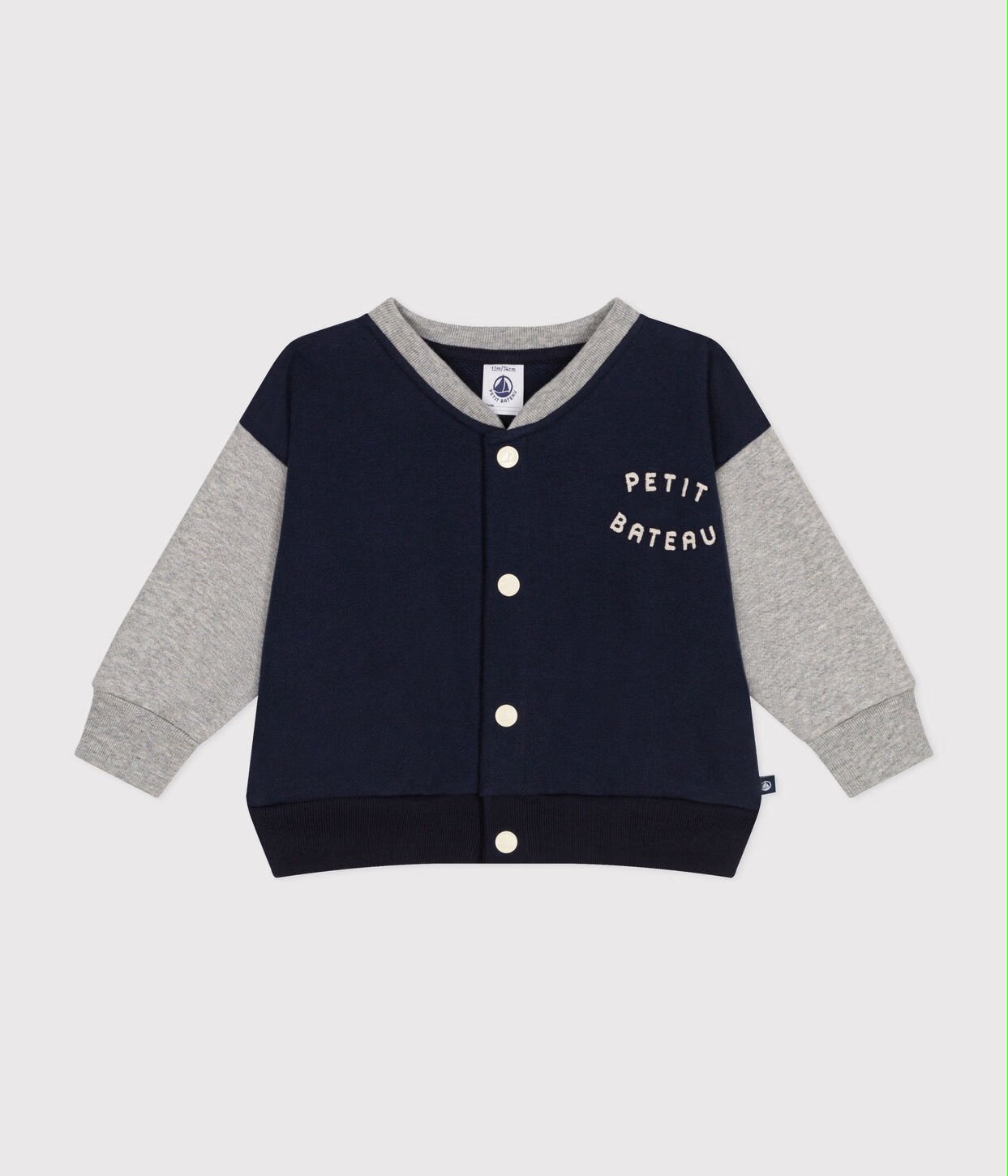  une veste teddy en molleton bleu marine et gris de la marque Petit Batea