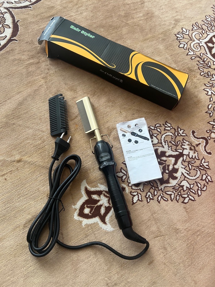 Brosse chauffante bouclante