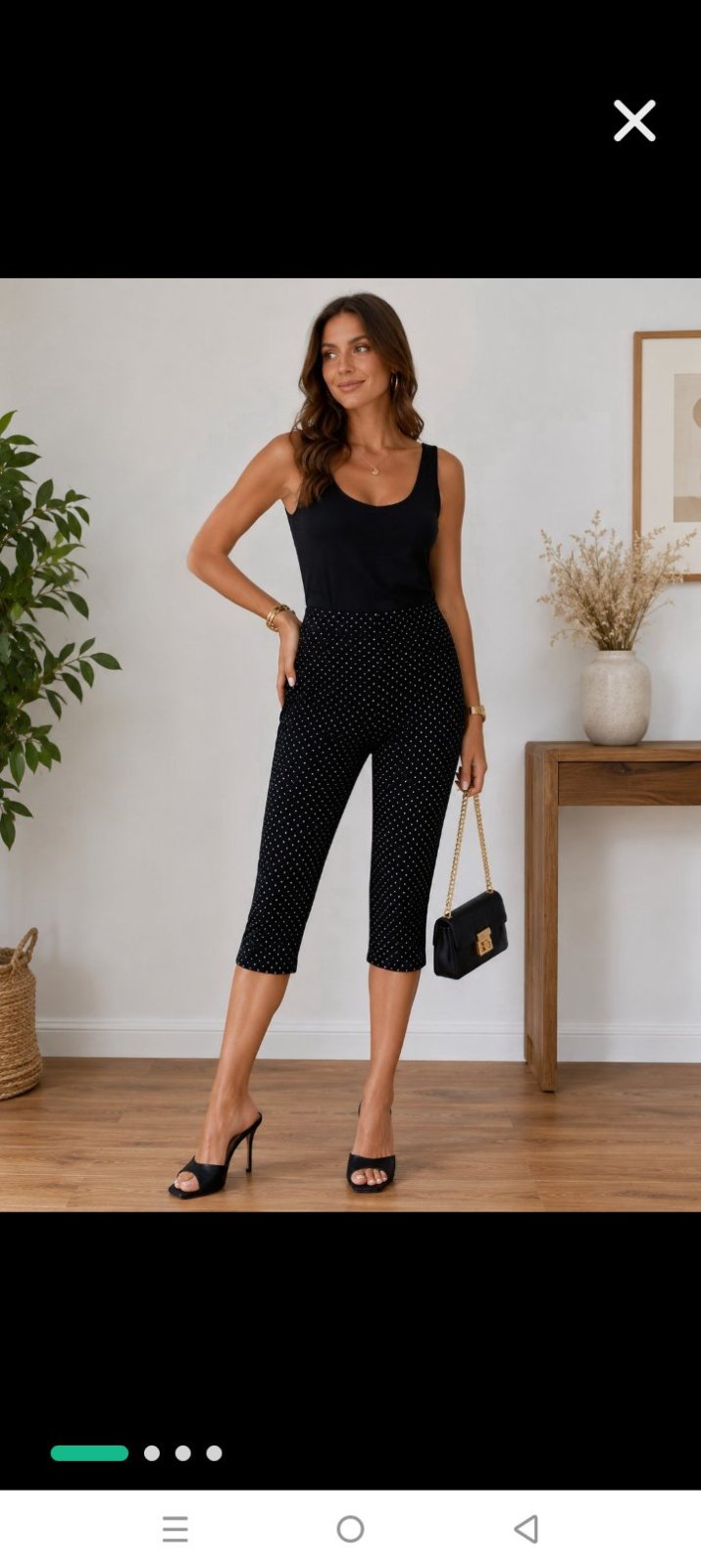 Capri de la marque Reitmans. Noir avec étoiles blanches. Très tendance. 