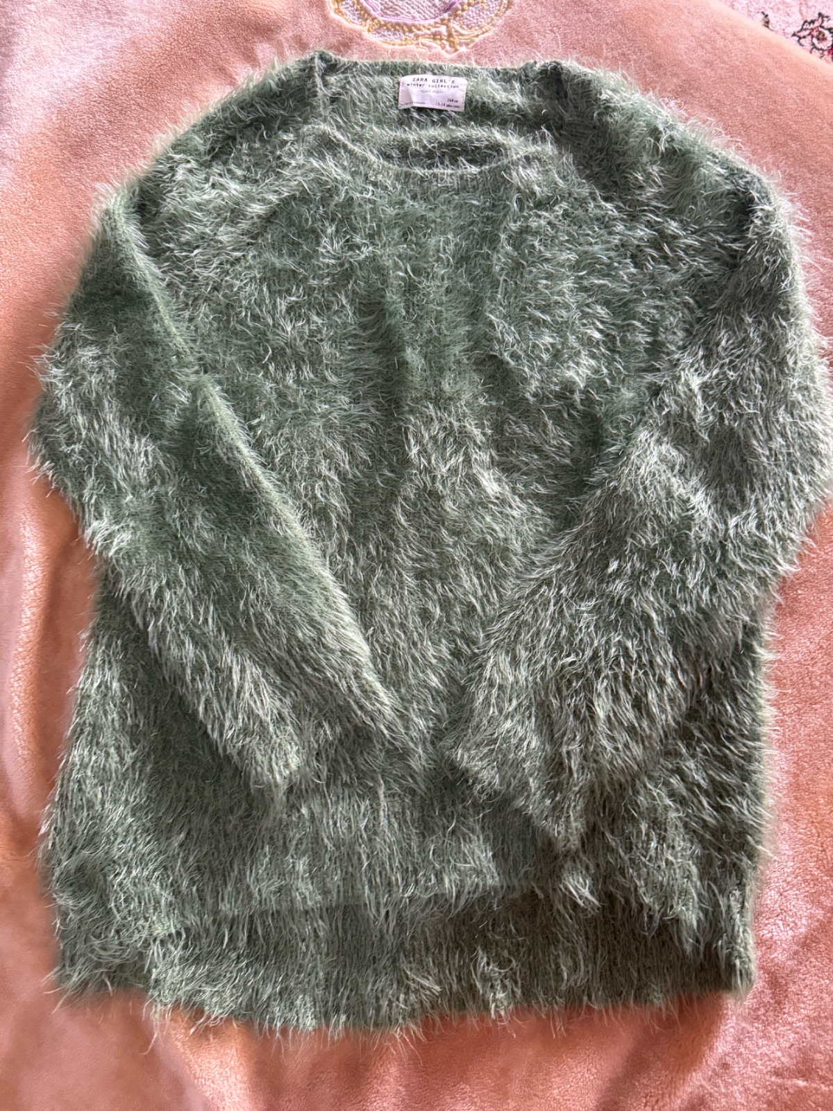 Pull en fourrure verte