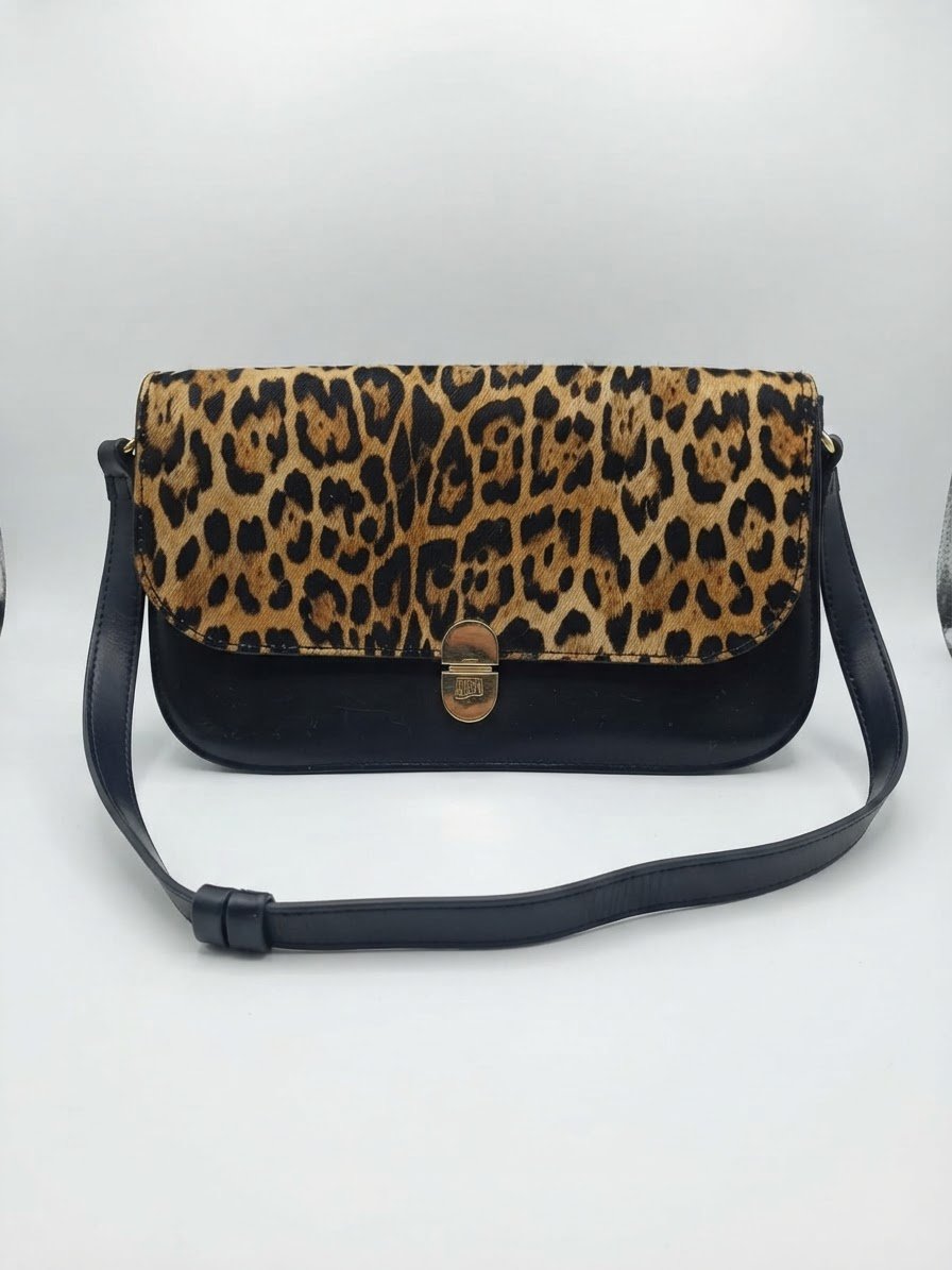 Sac à main tres elegant togre et noir neuf