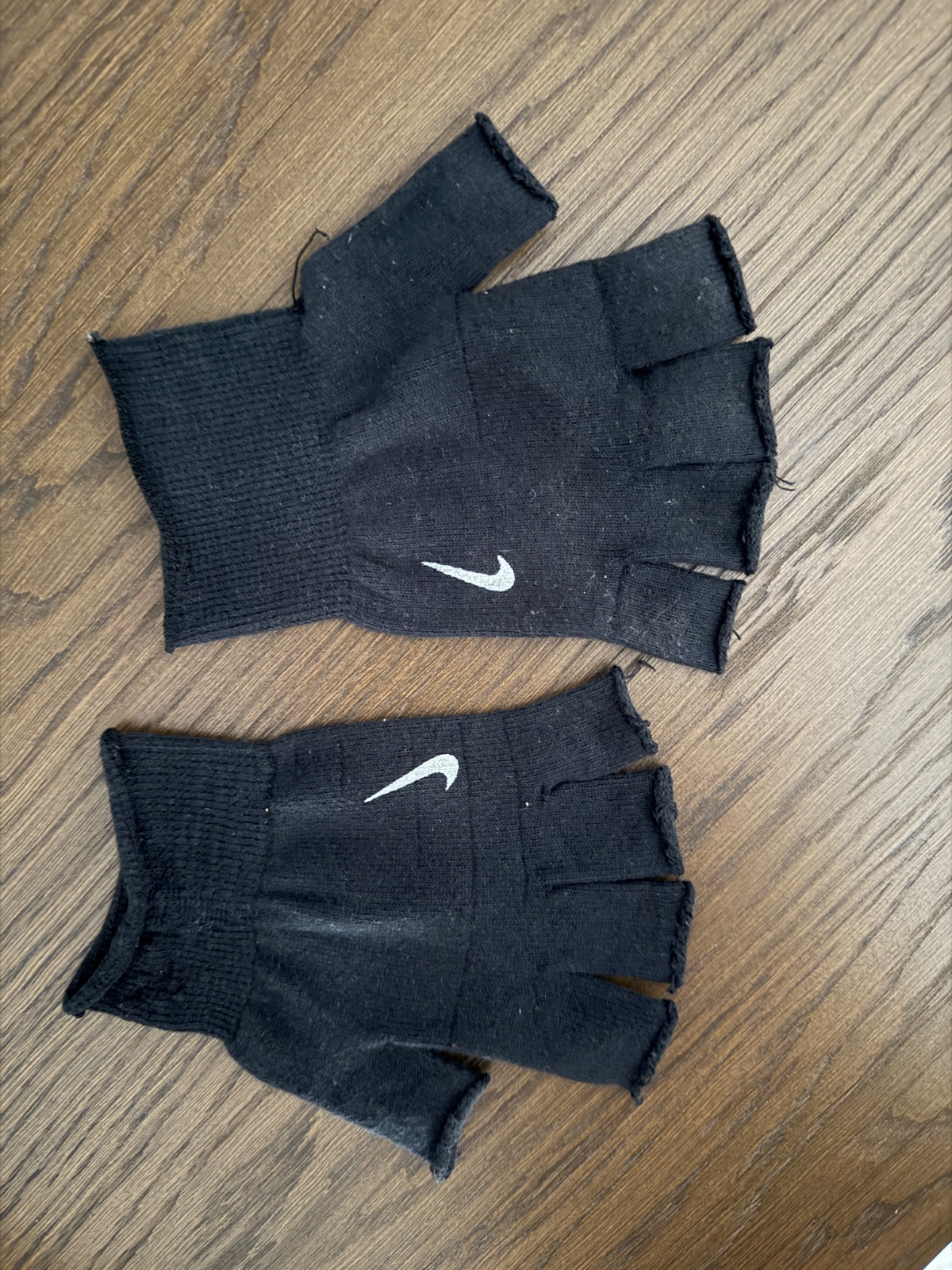Mitaines / gants sans doigts noirs Nike