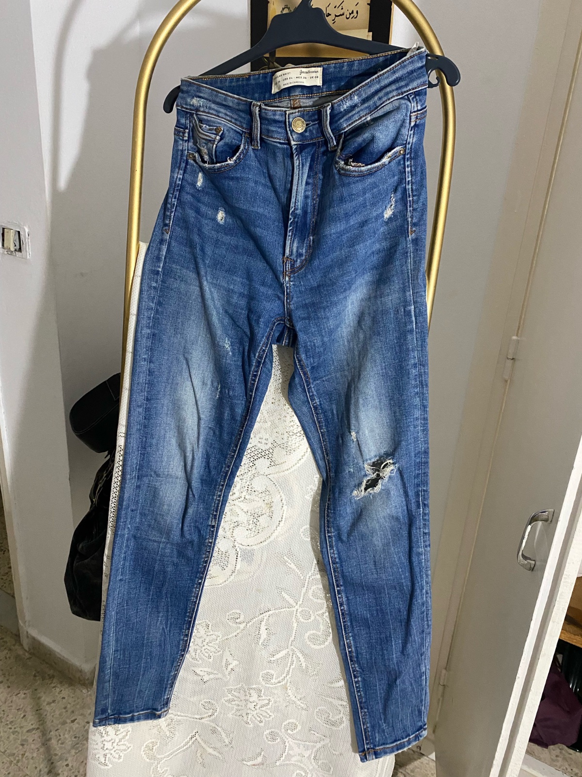 Jean bleu dechiré taille haute skinny