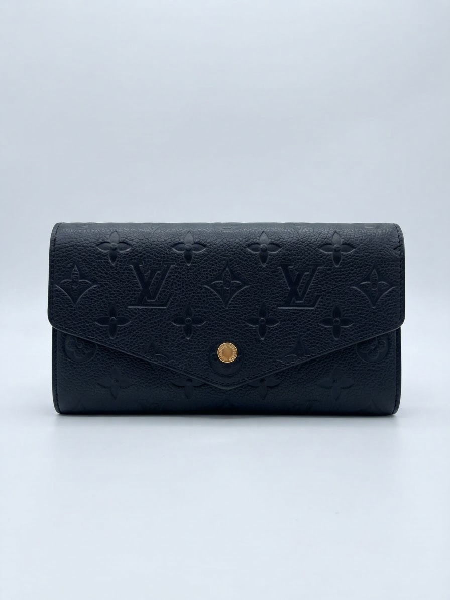 Le portefeuile Emilie LV en cuir Monogram Empreinte