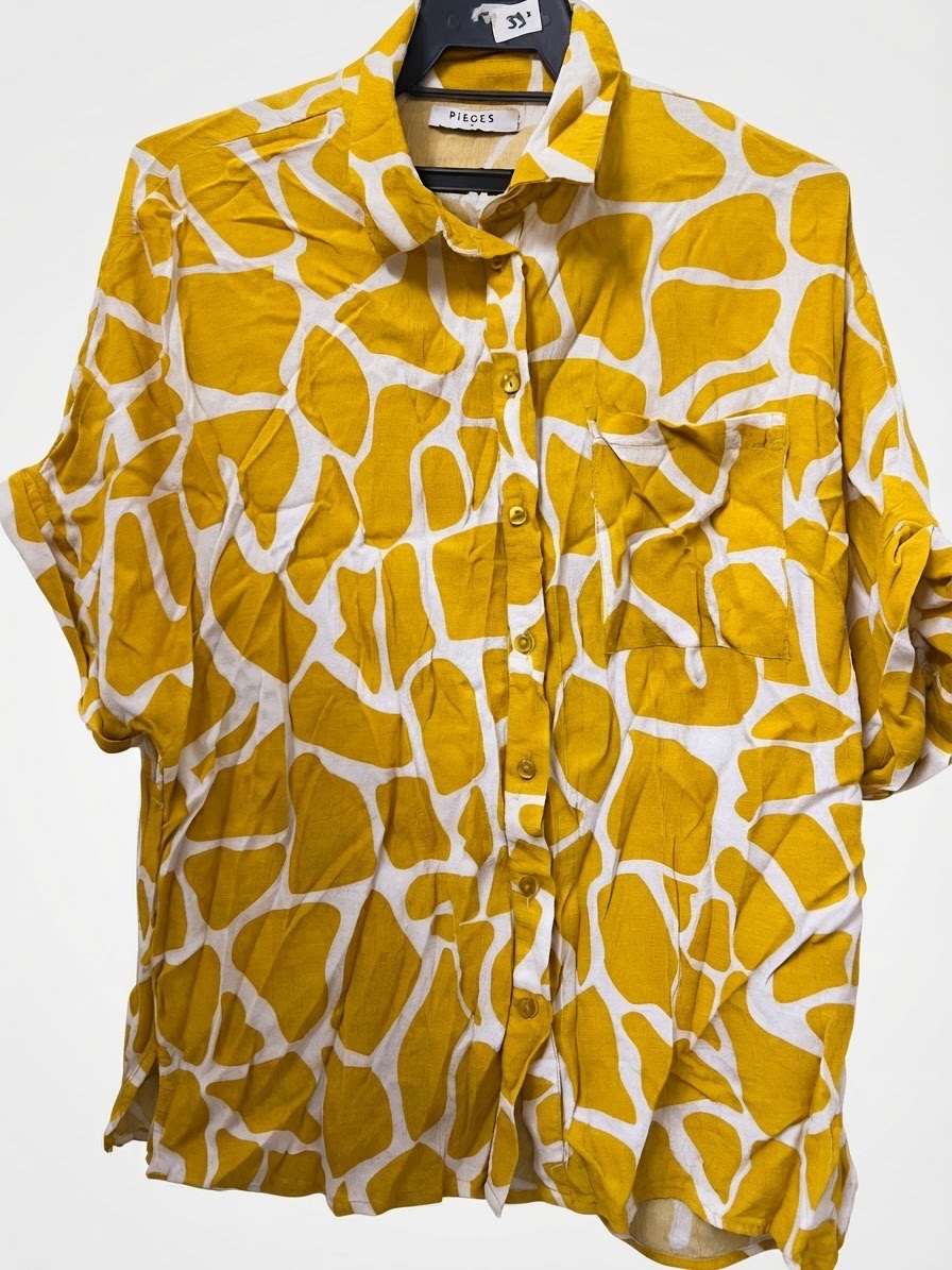 Chemise a la marque pieces tres belle 