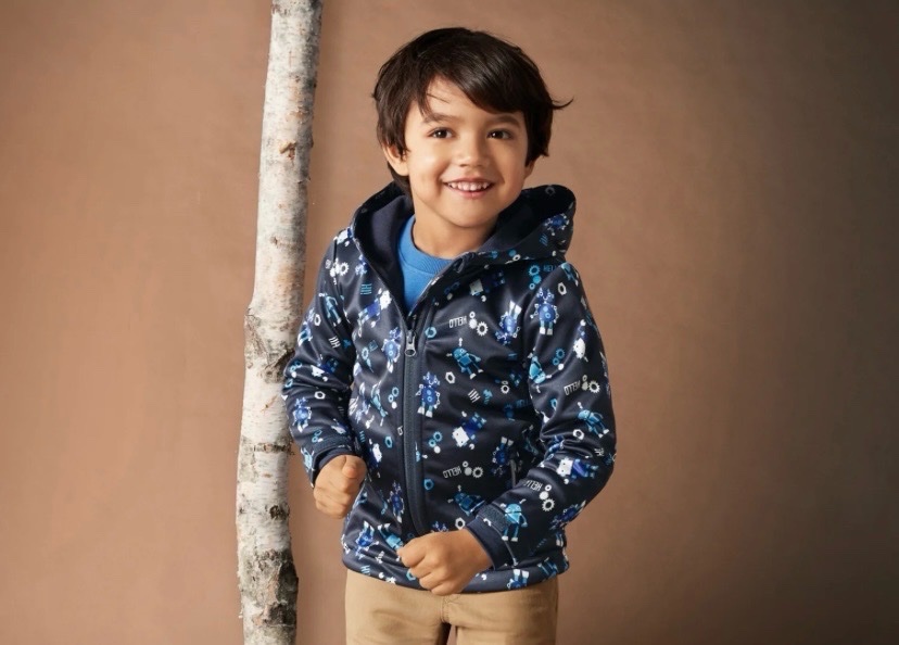 D'une veste softshell pour petit garçon de la marque Lupilu, arborant un motif de robots age 6/8