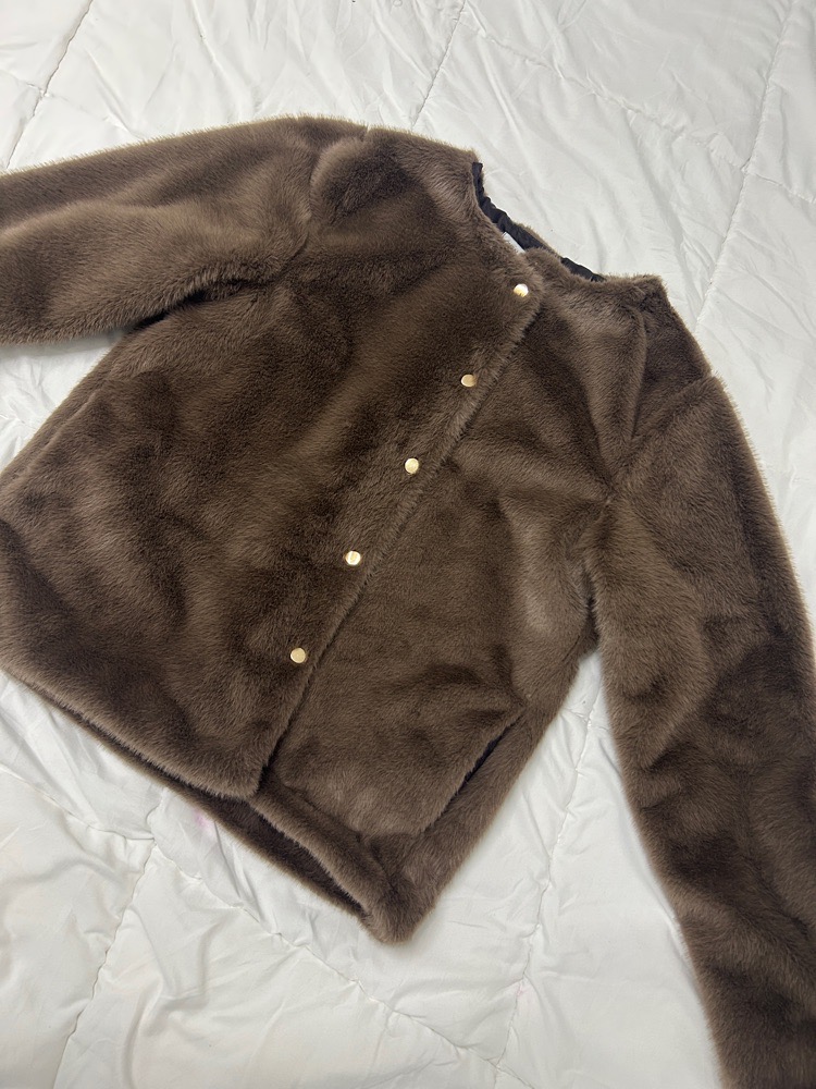 Veste fourrure en marron jamais portée 