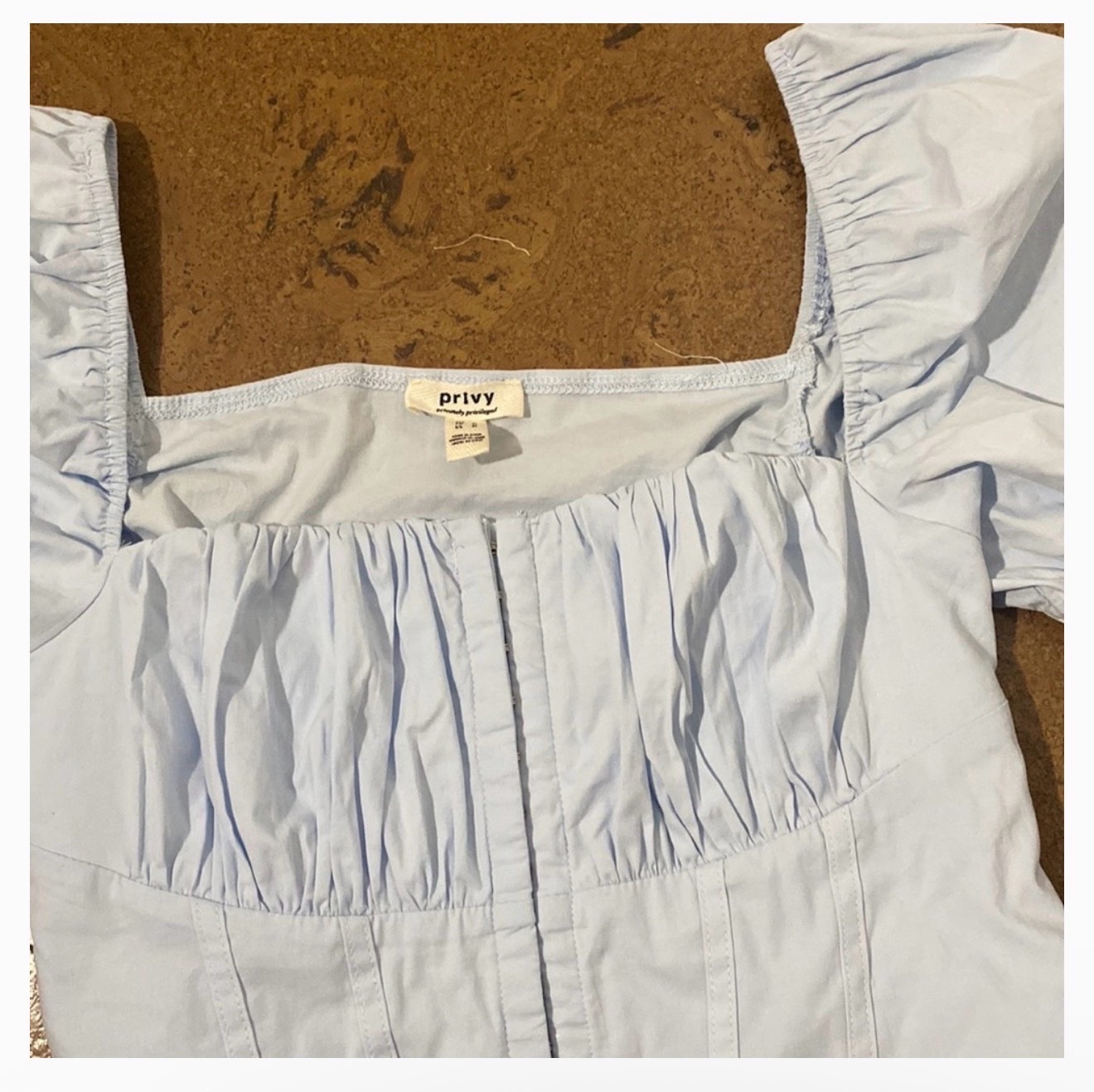 Top bleu clair de style corset à manches bouffantes Taille M