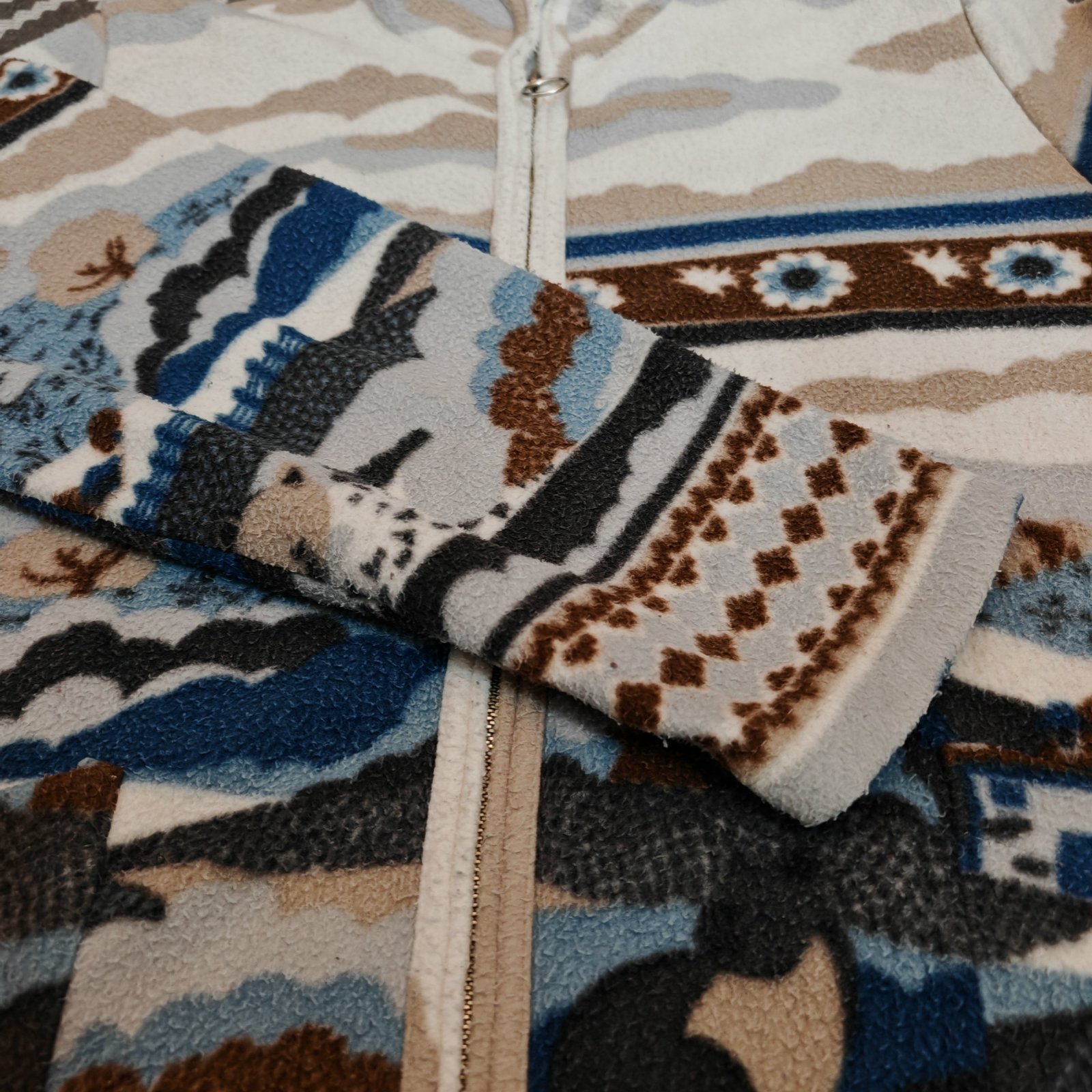 Veste polaire zippée à motif jacquard (souvent appelée aussi pull polaire zippé