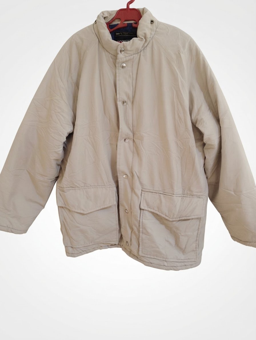 Veste beige avec un col montant 