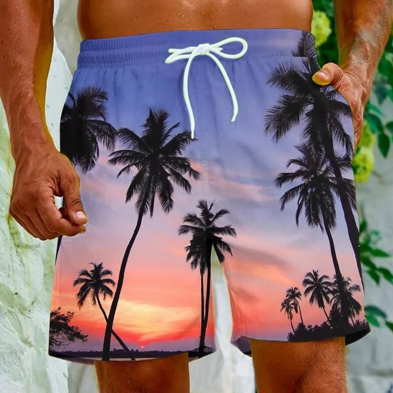 Short de bain imprimé graphique saisissant de palmiers sur fond de coucher de soleil