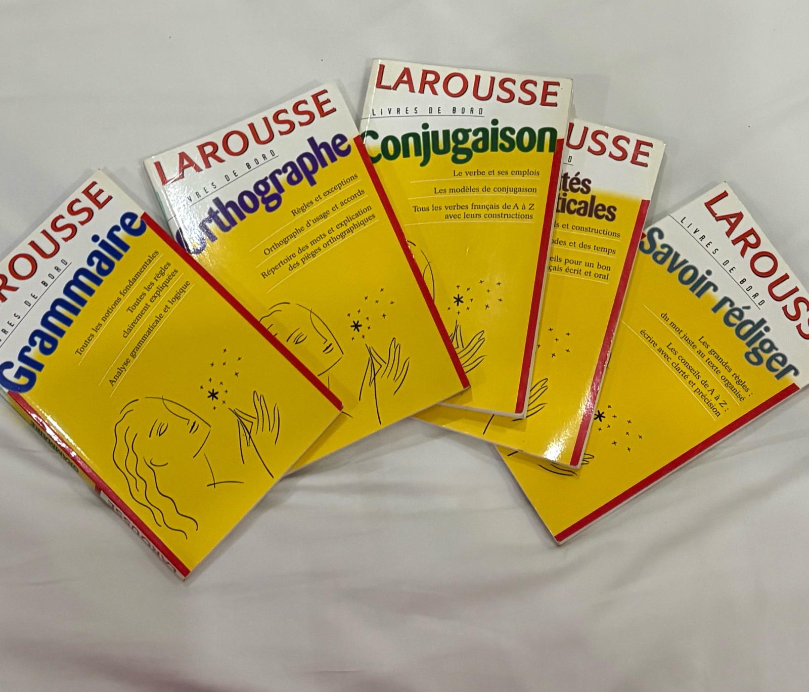 Livres Larousse de la collection Livres de Bord, centrés sur la grammaire, l'orthographe, la conjugaison, et la rédaction française