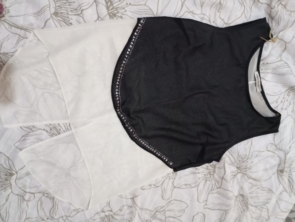 Chemise soirée sans manche trés peu porté 