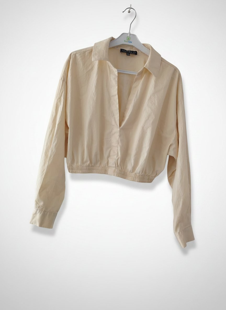 Une bloose crop taille 38/40