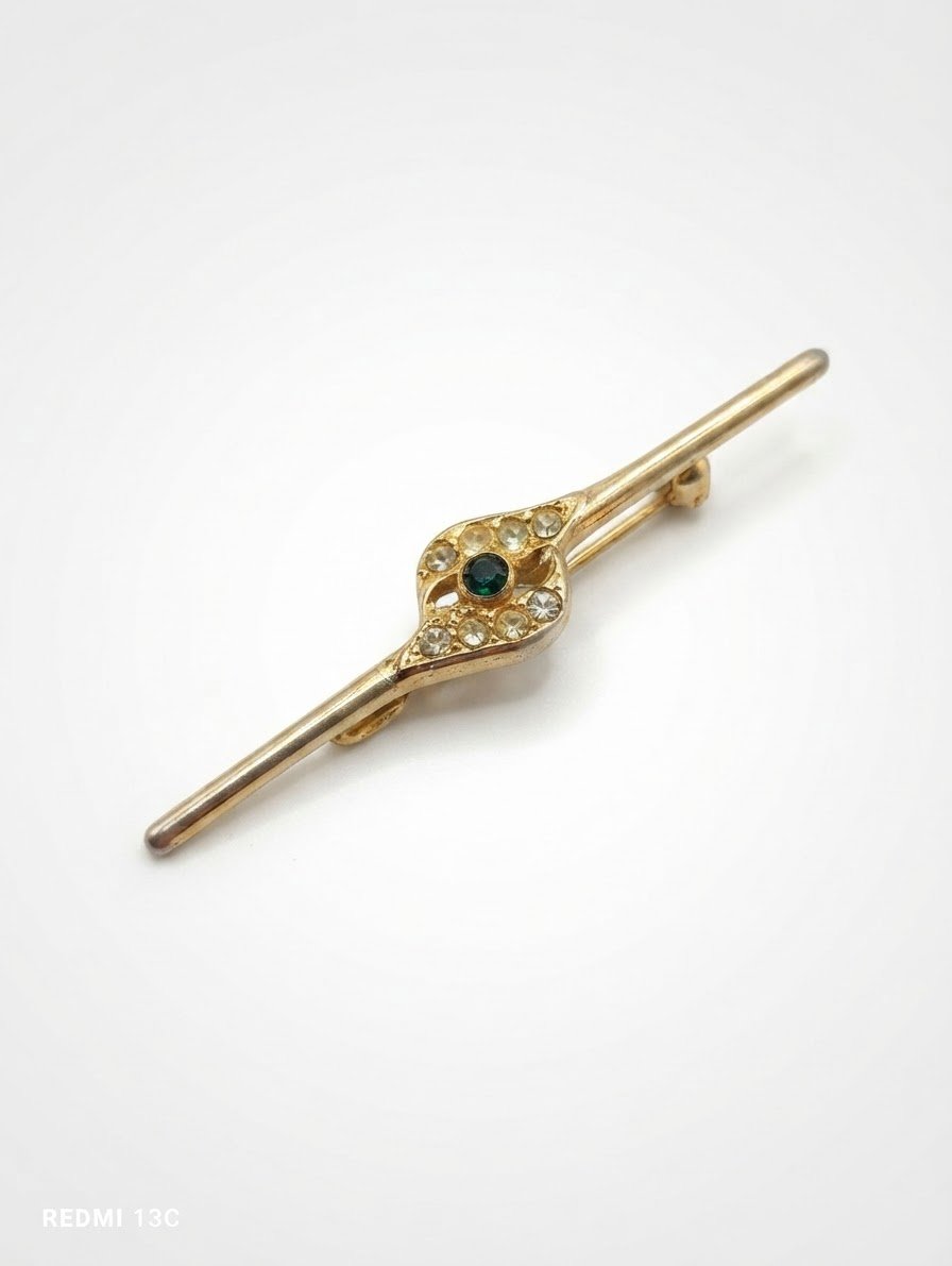 Broche en acier doré 
