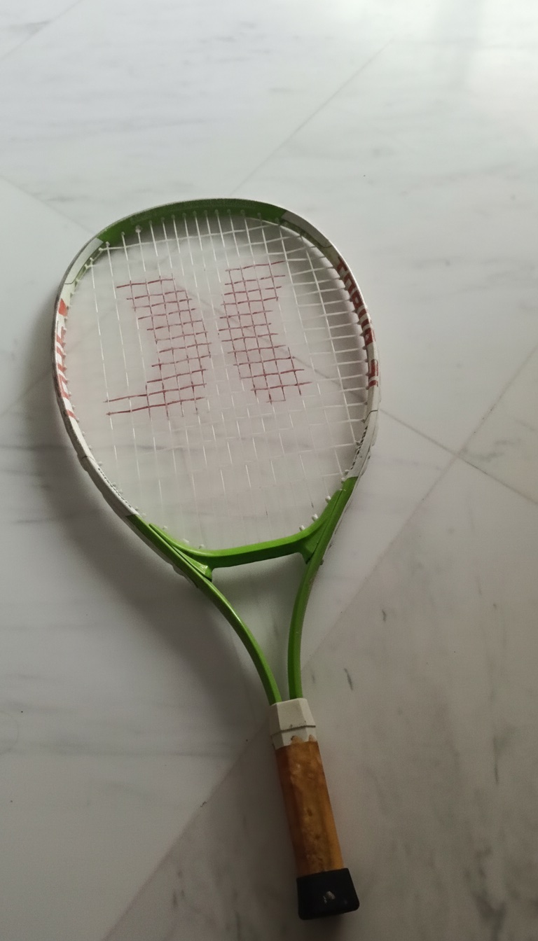Raquette de tennis Wilson verte et blanche 🎾