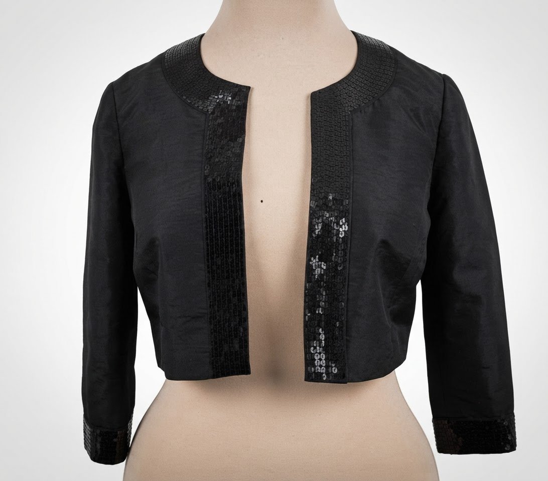 Veste courte (boléro) fiition sequin , neuve marque "Début "