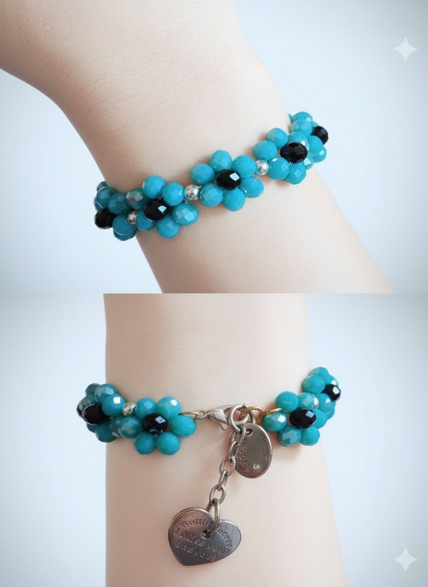 Magnifique bracelet fait main en perles facettées turquoise et noires. 💙