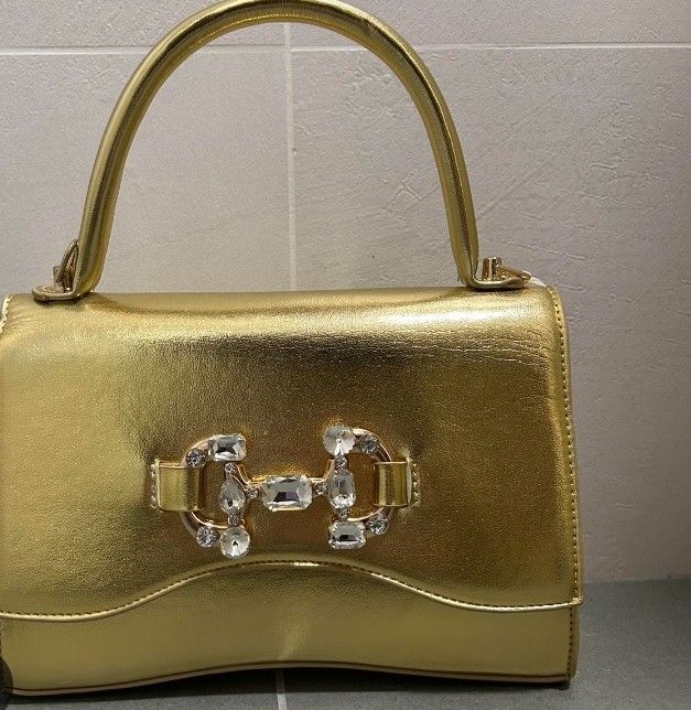 Sac doré a bandouliere de marque neuf