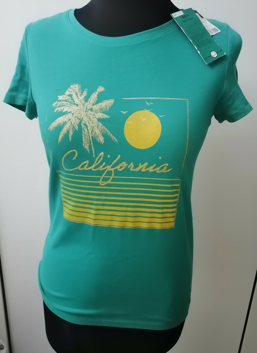 Pull coton organique turquoise avec un design pailleté 