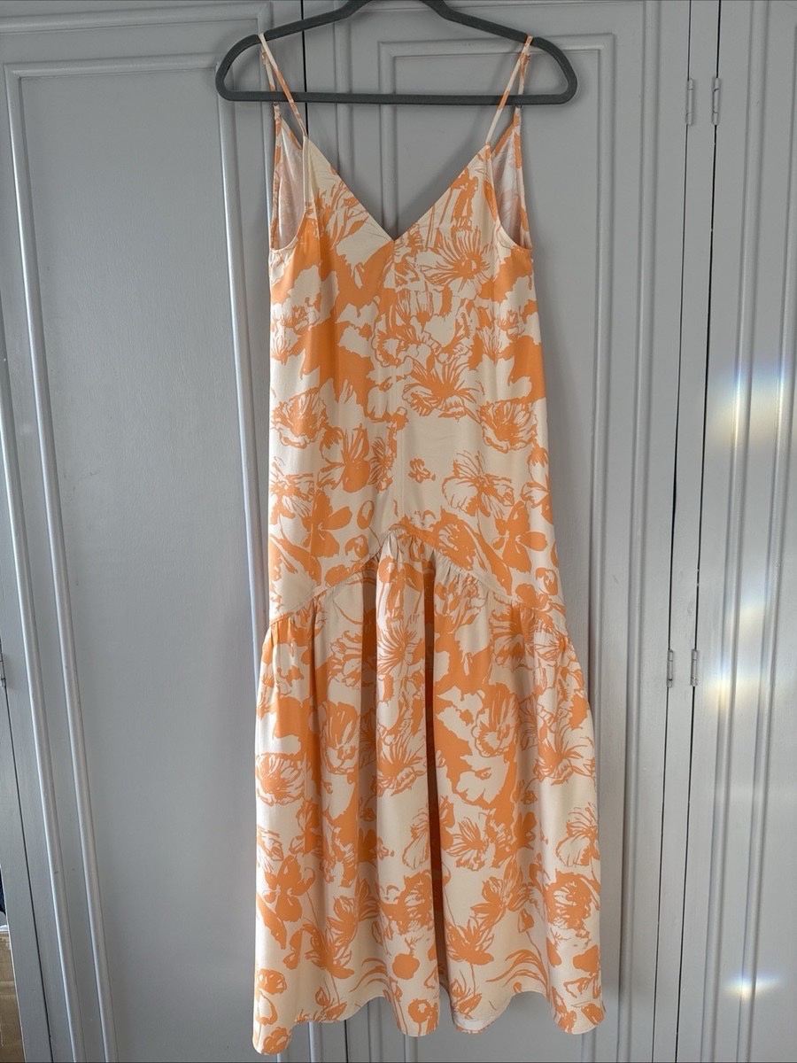 Robe courte à bretelles de couleur crème et orange ornée d'un imprimé floral tropica 