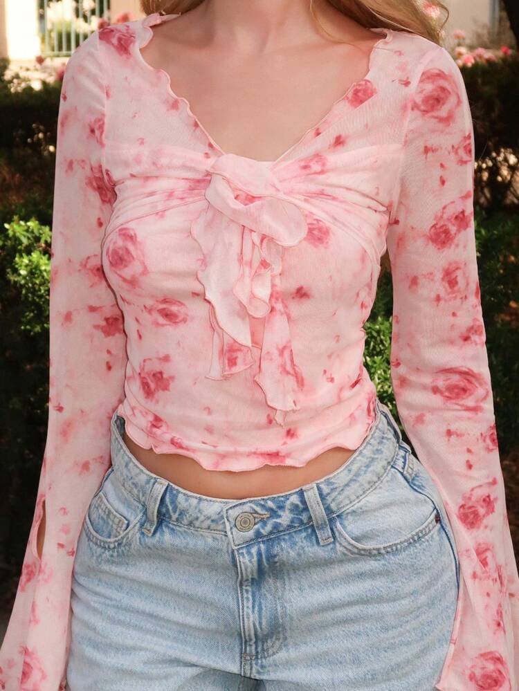 Floral top with bell flowy sleeves and a tie