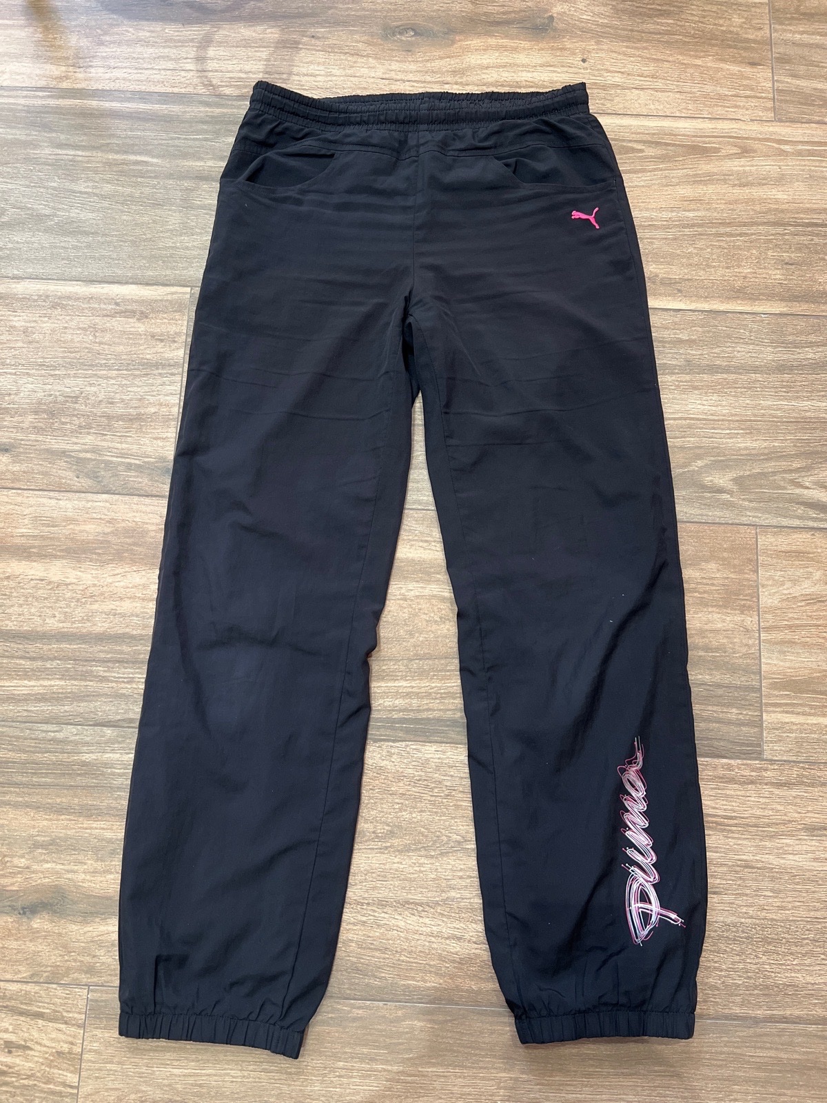 Pantalon de survêtement / Jogging Puma noir avec détails rose fuchsia