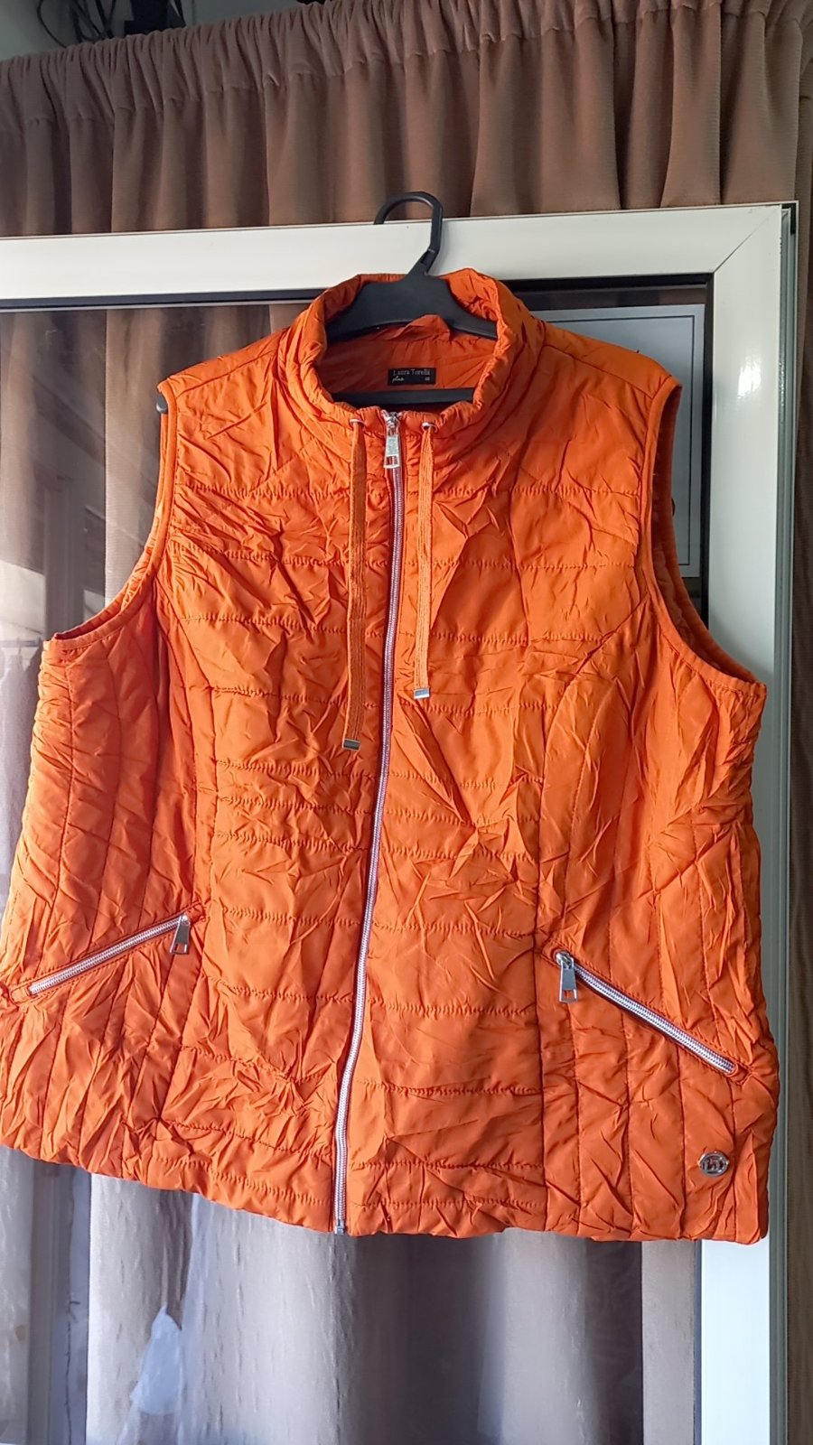 Doudoune presque neuf  matelassé orange pour femme. 