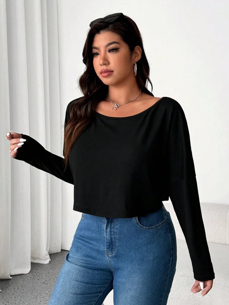 T-shirt noir à manches longues pour femme, doté d'une ample encolure dégagée et d'une coupe fluide et décontractée. [1] (https://freewear.de/Flowy-Long-Sleeve-Off-The-Shoulder-Tee-Bella-8850-BL8850)