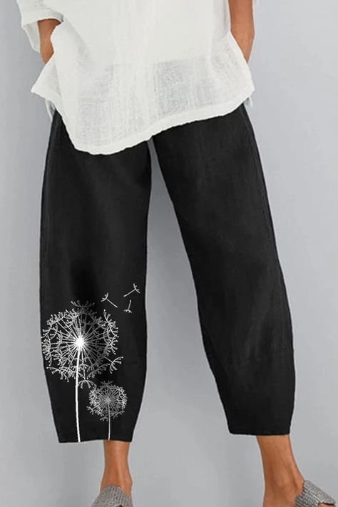 Pantalon large noir Fgnfyis arbore un délicat motif de pissenlit brodé sur la jambe.
