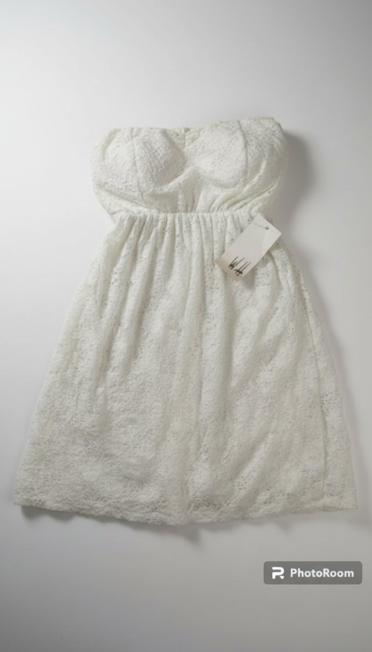 Très joli bustier en broderie anglaise avec doublure et élastique à la taille 