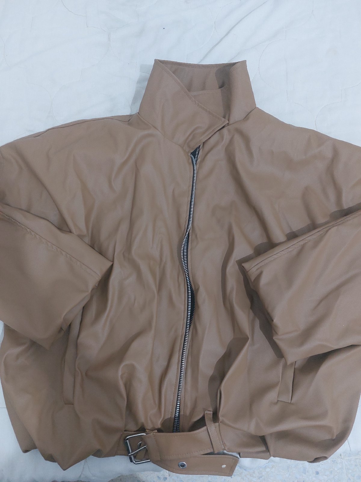 The trendy brown leather jucket 