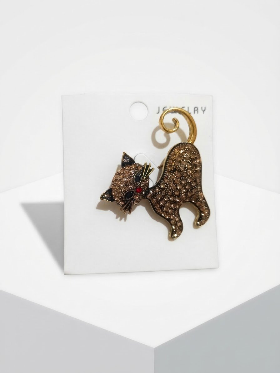 Broche inoxydable avec strass bronze