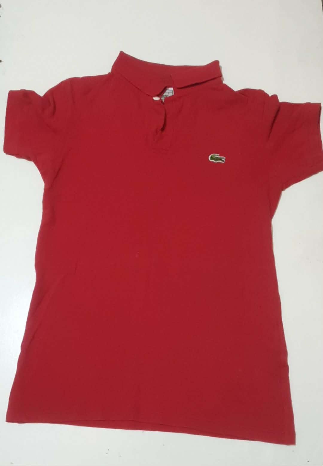 Lacoste pull rouge taille M