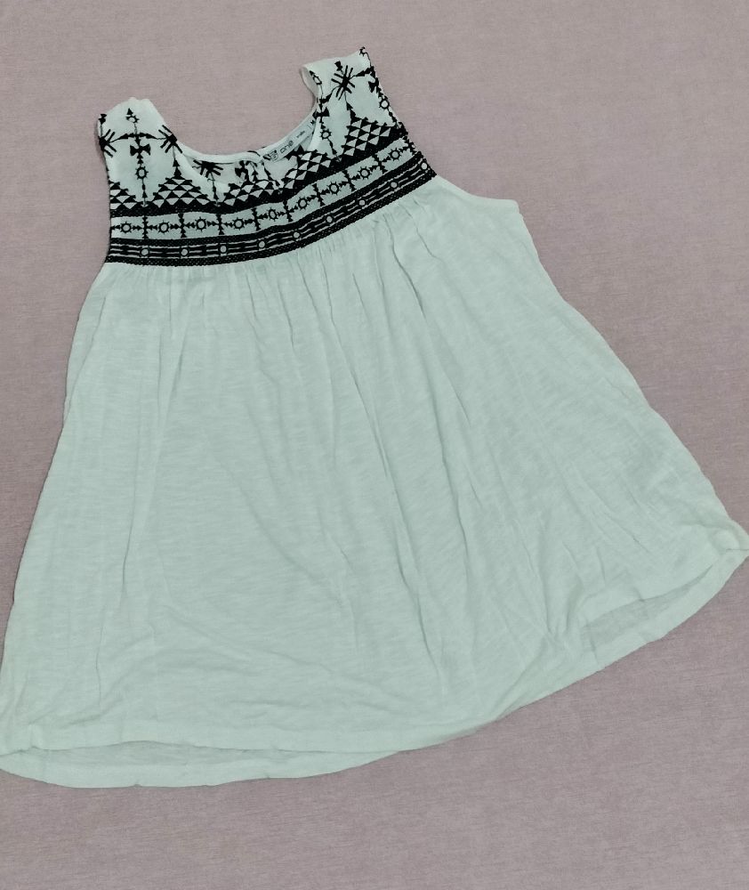 pull sans manches blanc et noir ample 