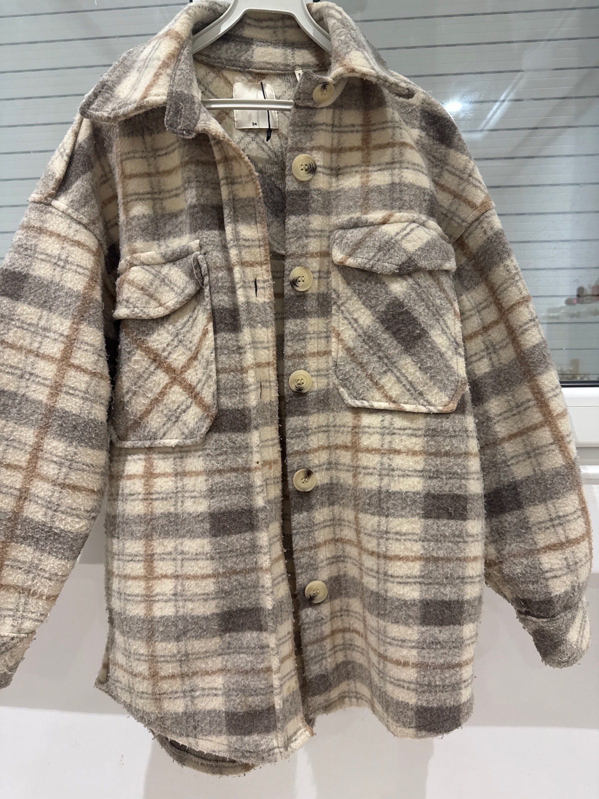Manteau beije taille 34(over size )peut etre portee jusqu'a 38