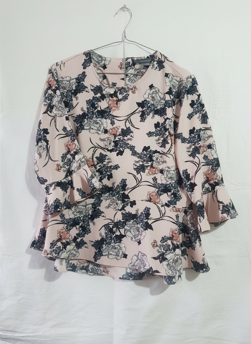 Chemisier fleuri rose de la marque Primark avec des manches à volants