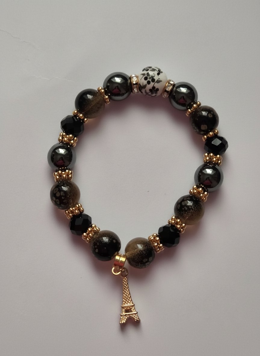 Bracelet perles noires, céramique & pendentif Tour Eiffel