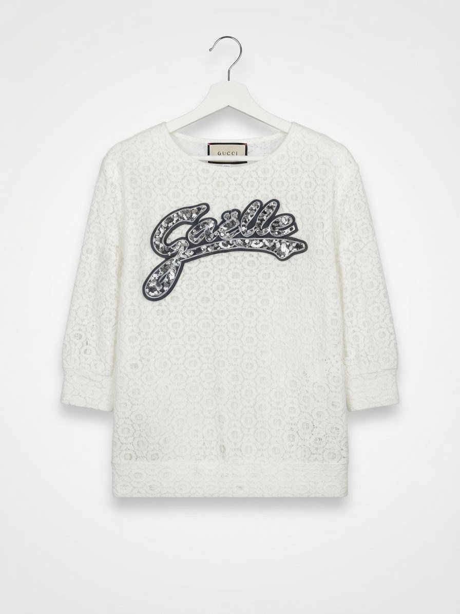 Top en dentelle blanc de la marque Gaelle pièce élégante caractérisée par son tissu ajouré 